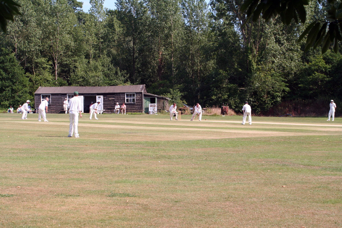 Match action in front of the old pavilion at Wickham